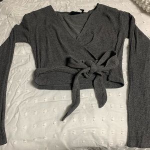 Cropped tie around long sleeve
